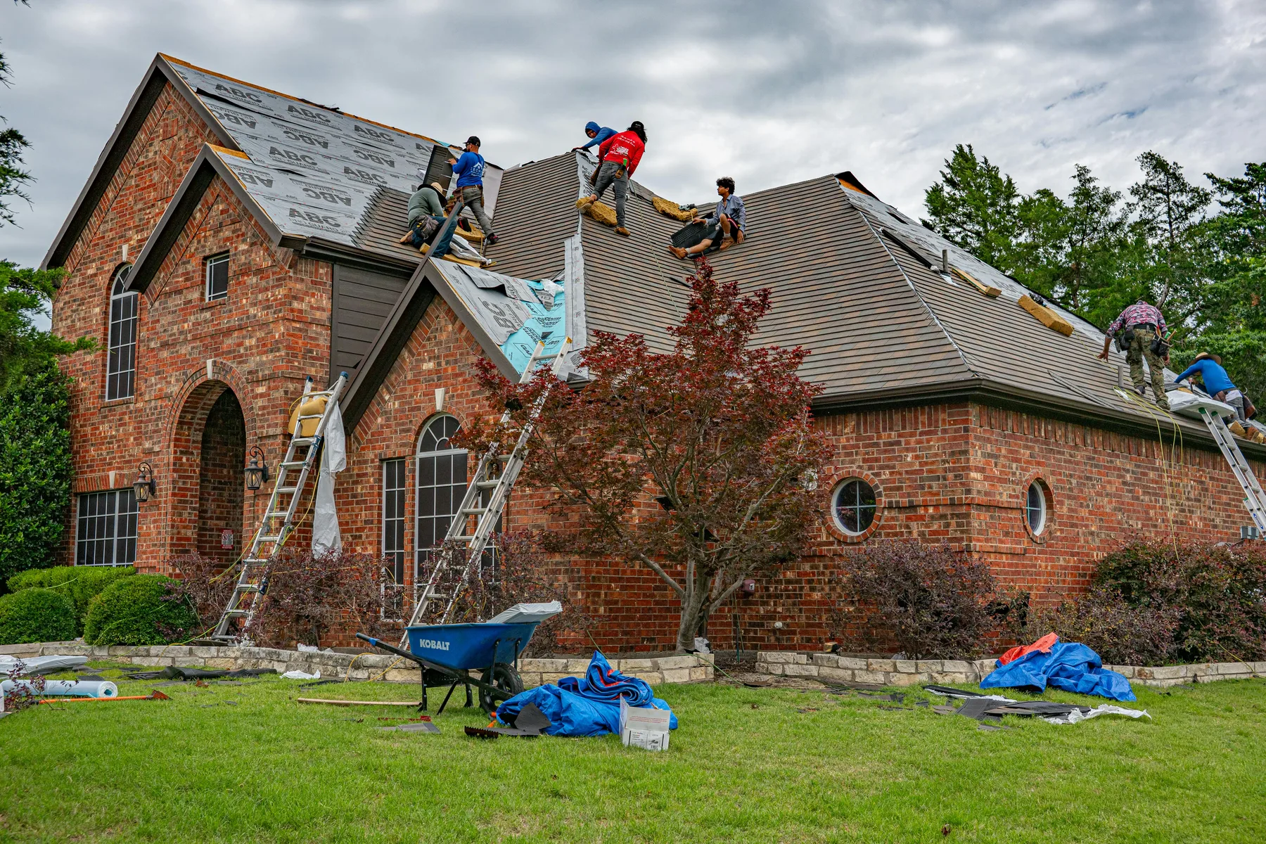 Residential roof surface checked for storm wear after Gulf Coast weather